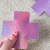 Naughty Thoughts Cross Pasties (5 Pairs) - Holographic Pink